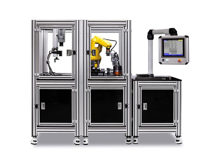Sistema de ensaio híbrido com manuseamento automático de peças para ensaios não destrutivos